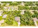 Expansive aerial view of the home, showcasing the pool and lush greenery of the surrounding community at 4238 Golfair Ln, North Port, FL 34288