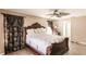 Bedroom featuring tile flooring, a ceiling fan, and ample natural light at 4238 Golfair Ln, North Port, FL 34288