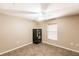 A basic bedroom featuring minimal furniture and a small window at 4238 Golfair Ln, North Port, FL 34288