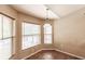 Bright breakfast nook with large windows, tile floors and decorative lighting at 4238 Golfair Ln, North Port, FL 34288