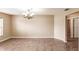 Charming dining room with tile floors, a chandelier, and neutral wall color at 4238 Golfair Ln, North Port, FL 34288