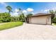 Beautiful home with an attached two car garage and circular paver driveway at 4238 Golfair Ln, North Port, FL 34288