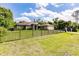 Charming home with a well-manicured lawn and decorative fence, adding to the curb appeal at 4238 Golfair Ln, North Port, FL 34288