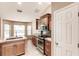 Open kitchen with granite countertops, stainless steel appliances and a large island at 4238 Golfair Ln, North Port, FL 34288