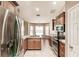 Modern kitchen with stainless steel appliances, granite countertops, and ample cabinet space at 4238 Golfair Ln, North Port, FL 34288