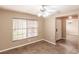 Inviting living room featuring tile flooring, natural light, and a modern ceiling fan at 4238 Golfair Ln, North Port, FL 34288