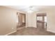 An open-concept living room features tile flooring and neutral paint tones at 4238 Golfair Ln, North Port, FL 34288