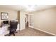 This office area features a ceiling fan, neutral color palette, and a closet at 4238 Golfair Ln, North Port, FL 34288