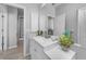 Bright bathroom with modern vanity and sink next to door at 4308 Summertree Rd, Venice, FL 34293