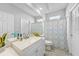 Bathroom with bright modern vanity and sink and enclosed toilet and shower at 4308 Summertree Rd, Venice, FL 34293