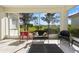 Screened patio with ample seating and a beautiful view of the neighborhood at 4308 Summertree Rd, Venice, FL 34293