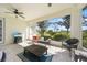 Screened patio with ample seating and a beautiful view of the neighborhood at 4308 Summertree Rd, Venice, FL 34293