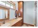 Well-lit bathroom featuring double sinks, spacious cabinets, and a walk-in shower at 50 Tarpon Way, Placida, FL 33946