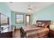 Well-lit bedroom with a wooden dresser, large bed, and a view of the ocean at 50 Tarpon Way, Placida, FL 33946