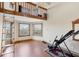 Spacious bonus room featuring wood floors, many windows, and a loft at 50 Tarpon Way, Placida, FL 33946