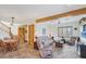The inviting living room features exposed wood beams and steps leading to the second floor at 50 Tarpon Way, Placida, FL 33946