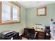 Office area featuring a large window for natural light and a dark wood desk at 50 Tarpon Way, Placida, FL 33946