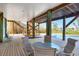 Relax outside and enjoy the shade on the outdoor patio with stairs, ceiling and a view of the pool at 50 Tarpon Way, Placida, FL 33946