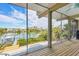Inviting screened porch with picturesque views of the waterway at 50 Tarpon Way, Placida, FL 33946