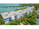 Stunning aerial view of the property with marina, beautiful landscaping and coastal views at 5858 Gasparilla Rd # 43, Boca Grande, FL 33921