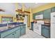 Functional kitchen area with appliances, a window, storage, and tile floor at 6345 Bodmin Ln, North Port, FL 34291