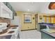 Functional kitchen with appliances, tile flooring, and lots of storage at 6345 Bodmin Ln, North Port, FL 34291