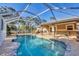 Enjoy a private, screened pool in a peaceful setting with mature landscaping at 6345 Bodmin Ln, North Port, FL 34291