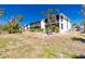 Exterior of the condo building featuring well-maintained landscaping at 6800 Placida Rd # 152, Englewood, FL 34224