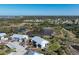 Picturesque aerial shot of the condo community near the coastline, featuring scenic ponds and trees at 6800 Placida Rd # 272, Englewood, FL 34224