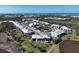 Lovely aerial view of condo community near waterfront, blending modern living with tranquil scenery at 6800 Placida Rd # 272, Englewood, FL 34224