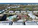 Enjoying the community pool, tennis courts, and picturesque lakes in this beautiful aerial view at 6800 Placida Rd # 272, Englewood, FL 34224