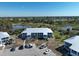 This building exterior shows maintained landscaping, ample parking and coastal charm at 6800 Placida Rd # 272, Englewood, FL 34224