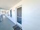 A welcoming doorway, number 212, with a practical screen door offers a blend of style and functionality at 6800 Placida Rd # 272, Englewood, FL 34224