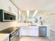 Stylish kitchen featuring modern appliances, white cabinetry and an open view to the living area at 6800 Placida Rd # 272, Englewood, FL 34224