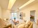 Inviting living area featuring comfortable seating, access to the balcony, and ample natural light at 6800 Placida Rd # 272, Englewood, FL 34224