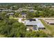 Birds eye view of a single-Gathering home with a screened in pool, and mature trees at 7328 Yardley St, Englewood, FL 34224