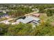 Aerial view of single-Gathering home with screened in pool, and mature trees at 7328 Yardley St, Englewood, FL 34224