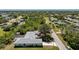 Aerial view of the house in a residential neighborhood at 7328 Yardley St, Englewood, FL 34224
