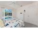 Bedroom featuring nautical-themed decor, including a lighthouse decoration and a white dresser at 7328 Yardley St, Englewood, FL 34224