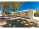 View of side of the house showing the windows and garage at 7328 Yardley St, Englewood, FL 34224