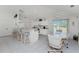 Spacious kitchen with breakfast bar, tiled floor and adjacent dining area at 7328 Yardley St, Englewood, FL 34224