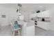 Eat in kitchen area with breakfast bar and bar stool seating. Offers lots of natural light at 7328 Yardley St, Englewood, FL 34224