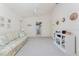 Bright living room with door leading to a bathroom at 7328 Yardley St, Englewood, FL 34224