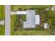 Birds eye view of the property showcasing landscaping and roof at 7339 Thomas St, Englewood, FL 34224