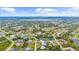 Aerial view showcasing a residential community with houses, trees, and neighborhood streets at 7339 Thomas St, Englewood, FL 34224