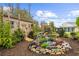 Backyard featuring a custom water feature and meticulous landscaping at 7339 Thomas St, Englewood, FL 34224