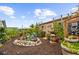Charming backyard with a rock-lined water feature, lush tropical plants, and decorative accents for serene outdoor living at 7339 Thomas St, Englewood, FL 34224