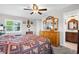 Bedroom with hardwood floors and an ensuite bathroom at 7339 Thomas St, Englewood, FL 34224