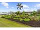 Expansive front yard boasting lush landscaping and mature palm tree at 7339 Thomas St, Englewood, FL 34224