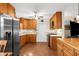 Bright kitchen with wood cabinets, stainless steel appliances, eat-in breakfast table and a view of the kitchen island at 7339 Thomas St, Englewood, FL 34224